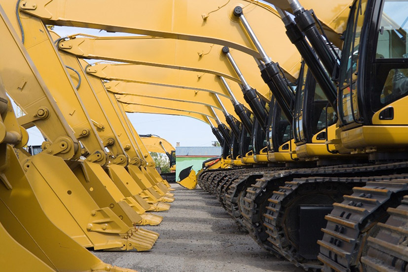 Image showing multiple diggers in a row 