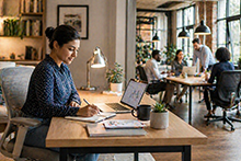Image of woman working at a desk